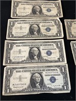 4 1957 A, 2 1957 B Blue Seal Dollars