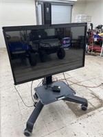 LG 50" TV on Rolling Stand (powers on)