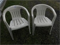 Pair of plastic patio chairs