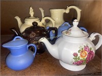 Group of teapots some have damage