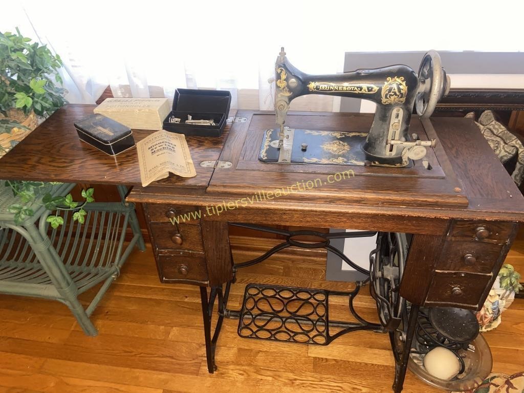 Antique Minnesota sewing machine with attachments
