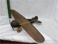 Early pressed steel toy airplane