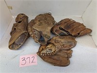 Lot of baseball gloves