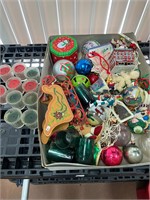 lot of Christmas ornaments and candles