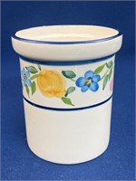 Ceramic floral utensil holder, has a chip on the