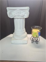 Column stand and new candle in votive with stand