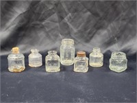 VARIETY OF VINTAGE GLASS JARS