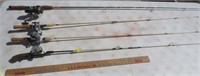 4 fishing poles with reels