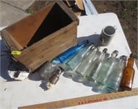 Wooden box, old bottles