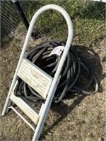 555) Folding step ladder, soaker hoses