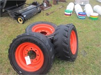 1240) 4 skid steer tires & wheels