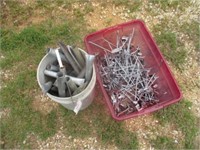 1260) Tote of hangers, bucket fence panel stakes