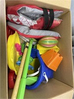 box of beach toys and beach ball