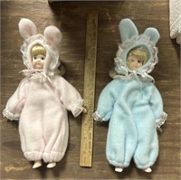 Blue and pink porcelain dolls dressed as bunnies