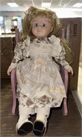 Wooden rocking chair and porcelain doll