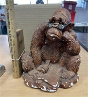 Ceramic gorilla figurine with Wall Street Journal