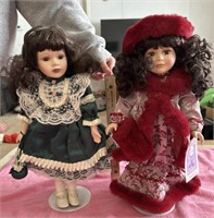 2 porcelain dolls with stands