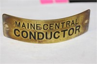 A Vintage Maine Central Conductor Head Badge