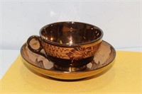 A Lusterware Cup and Saucer