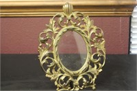 A Cast Iron Gold Frame