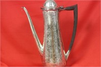A Handcarved Sterling Teapot