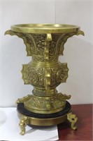 A Chinese Bronze Urn on Stand