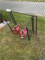 338) Two 2gal gas cans, small table