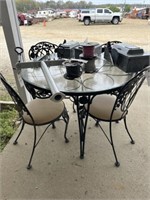 31) Metal table w/ glass top & 4 chairs