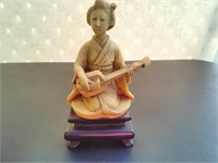 A Japanese Mid Century Resin Musician Figurine