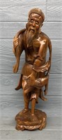 Large Wooden Man Holding Fish Carving