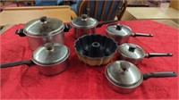 STAINLESS STEEL POTS AND A BUNDT PAN