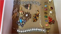 BOX OF UNIQUE BROOCHES- EARRINGS- AND A BRACELET