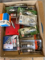 Assorted spark plugs appear new.