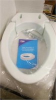 Hinged toilet seat riser