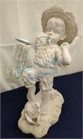 Boy blowing bubbles statue