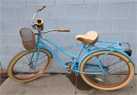 Blue huffy bike with basket and cup holder