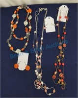 Three necklace and earring sets