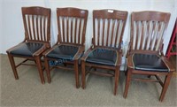 Four wood dining chairs, leather seats