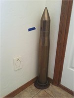BRASS BULLET ON WOOD STAND