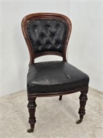 EARLY LEATHER UPHOLSTERED CHAIR