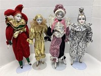 Four Porcelain Jester Clown Dolls with Stands