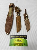 3 knives with sheaths