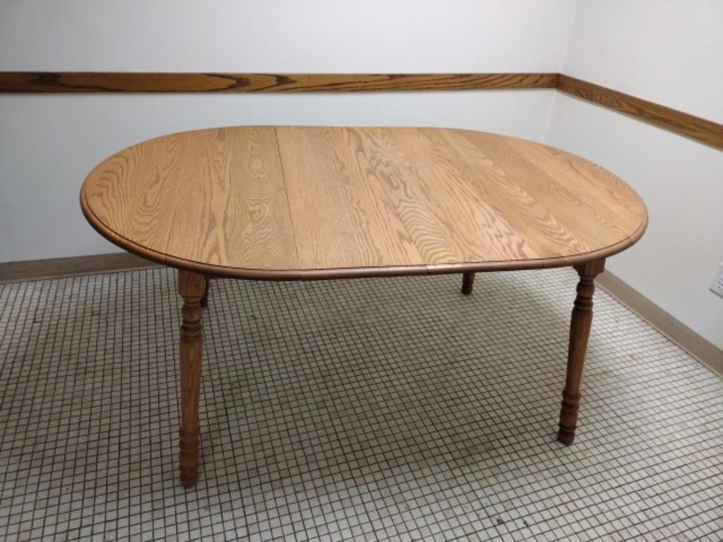 Oak double drop leaf dining table with two