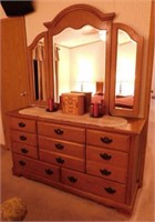 Oak dresser w/ 11 drawers & beveled folding mirror