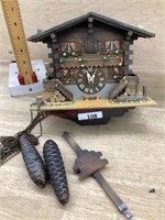 Wood cuckoo clock with weights and pendulum