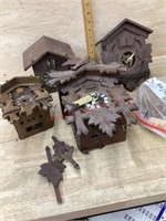 4 Cuckoo clocks and parts all need repairs