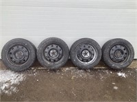 4 winter tires off a ford escape - black rims