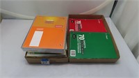 assorted notebooks, some partially used, paper