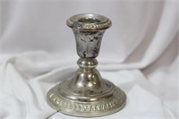 A Single Weighted Sterling Silver Candle Stick
