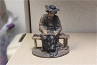 Cast Iron Man Sitting on the Bench